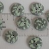 21 mm – 9 vnt. pilkos sagos su žalsvu, augalinių motyvų ornamentu 