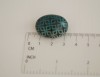 Ovali sagė „Šaltos žalios ornamentai tamsiame fone“ (pin07)
