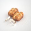 Žaismingi kabantys auskarai „Brioche“ Žaismingi kabantys auskarai „Brioche“
